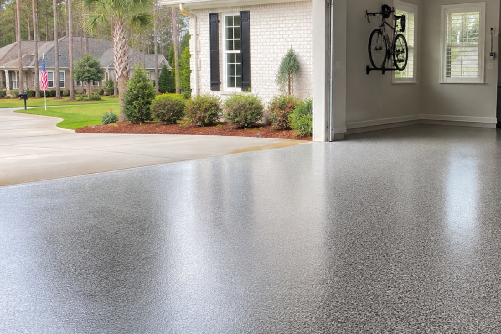 Second finished gray flake floor in a bright residential garage