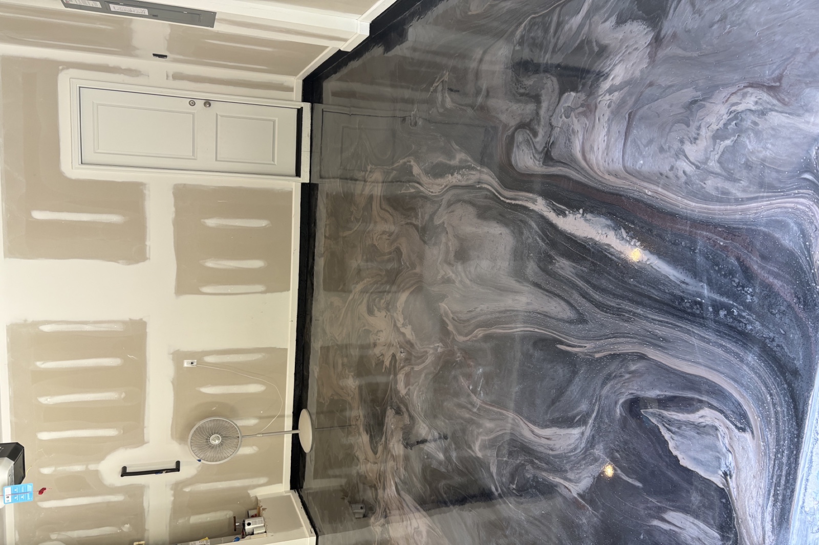 Finished custom gray and pearl metallic epoxy floor in a residential garage